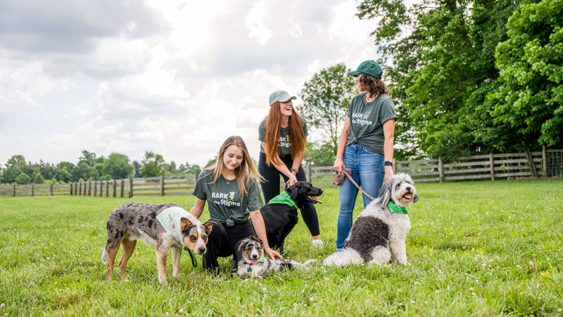 Ladies with dogs wearing Bark the Stigma™ collection