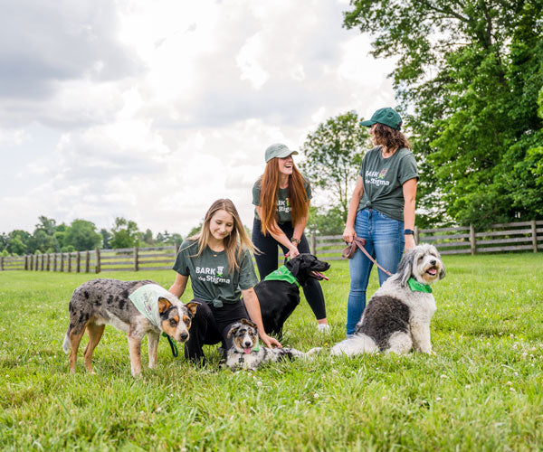 Ladies with dogs wearing Bark the Stigma™ collection